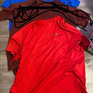 Under armour shirts top and bottom one not the middle one